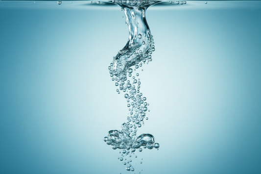 Hydrogen water bubbles rising through pure water — molecular H₂ generation process